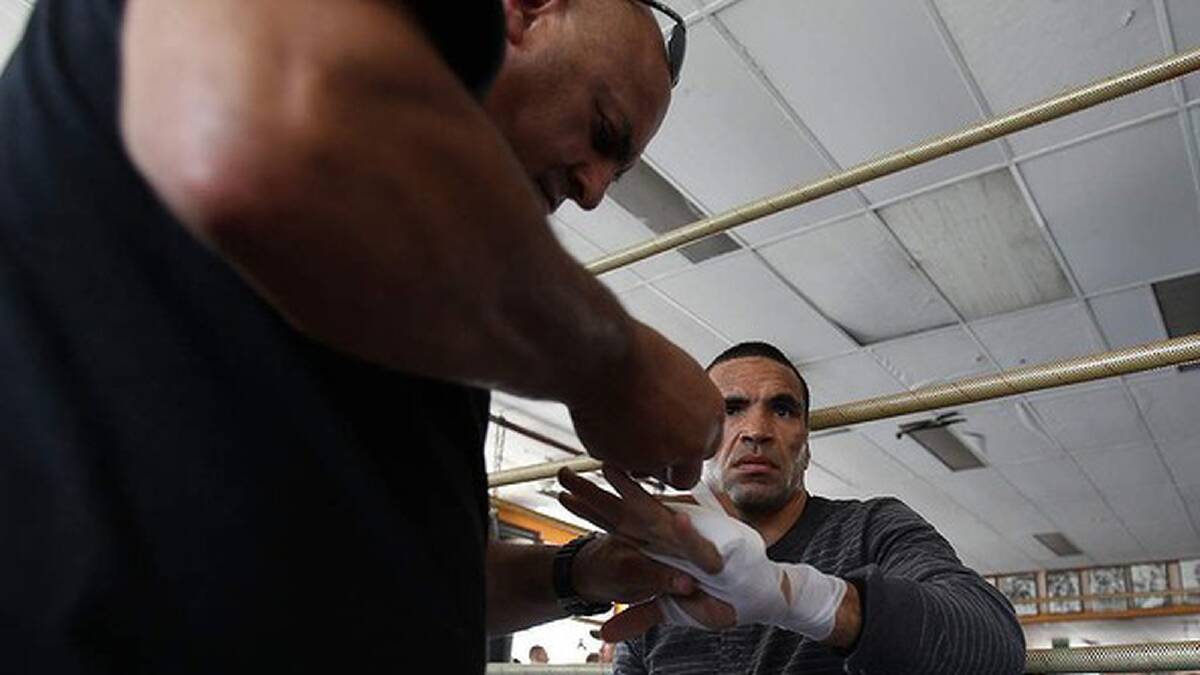Mundine gets his hands strapped. Photo: Anthony Johnson