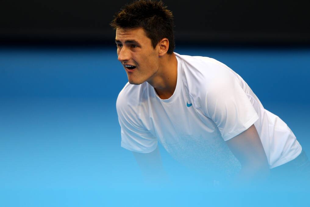 Bernard Tomic of Australia in action in his first round match against Leonardo Mayer of Argentina during day two of the 2013 Australian Open. Photo by Robert Prezioso/Getty Images