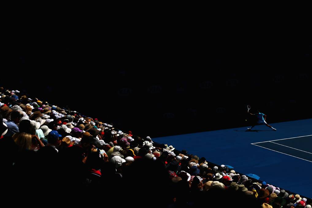 Roger Federer of Switzerland plays a forehand in his first round match against Benoit Paire of France during day two of the 2013 Australian Open. Photo by Ryan Pierse/Getty Images