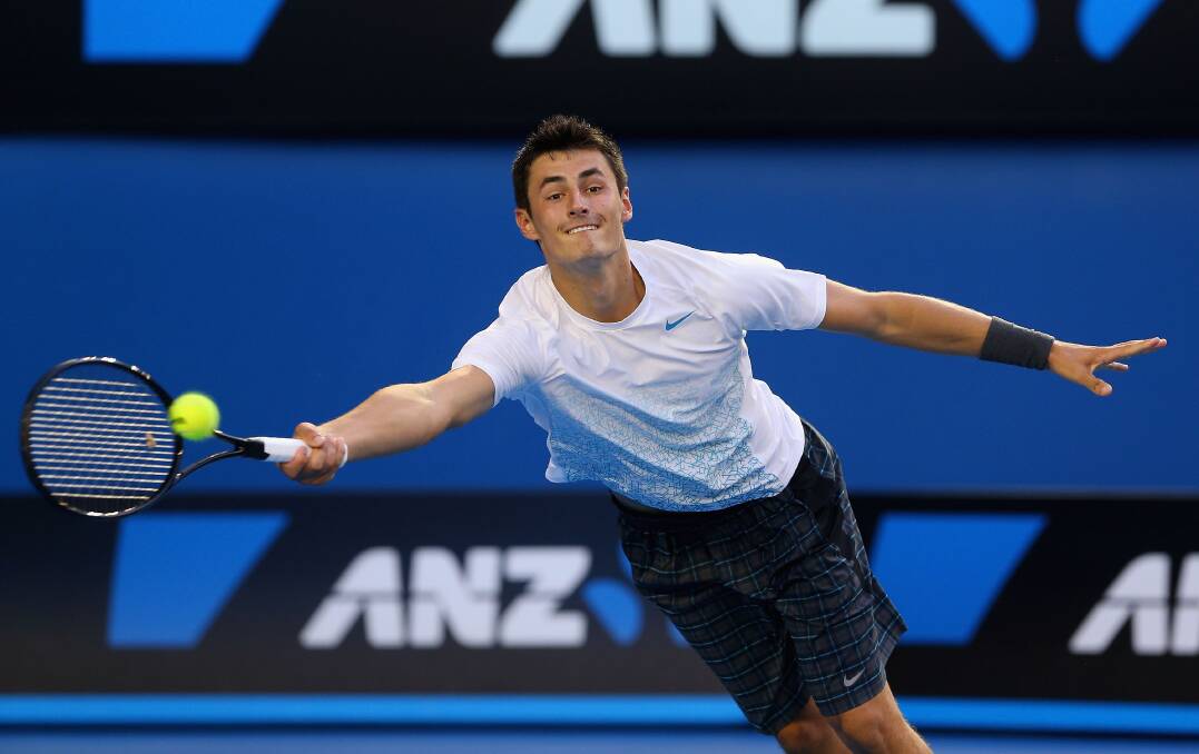 Bernard Tomic of Australia wipes his brow in his first round match against Leonardo Mayer of Argentina during day two of the 2013 Australian Open. Photo by Robert Prezioso/Getty Images
