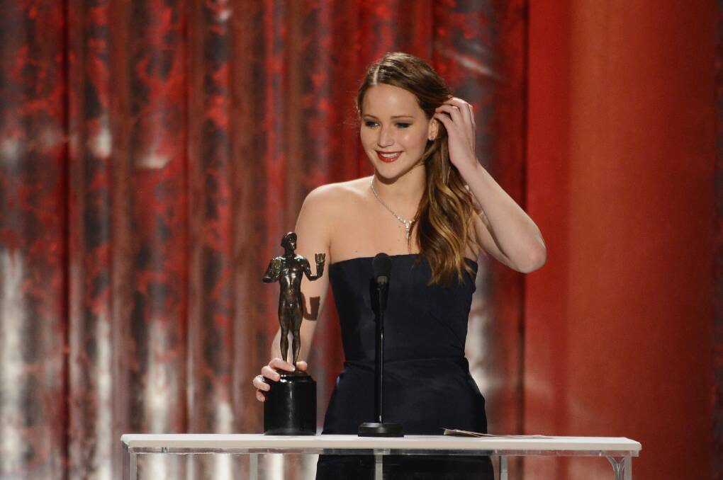 Actress Jennifer Lawrence accepts the award for Outstanding Performance by a Female Actor in a Leading Role for 'Silver Linings Playbook'. Photo by Mark Davis/Getty Images
