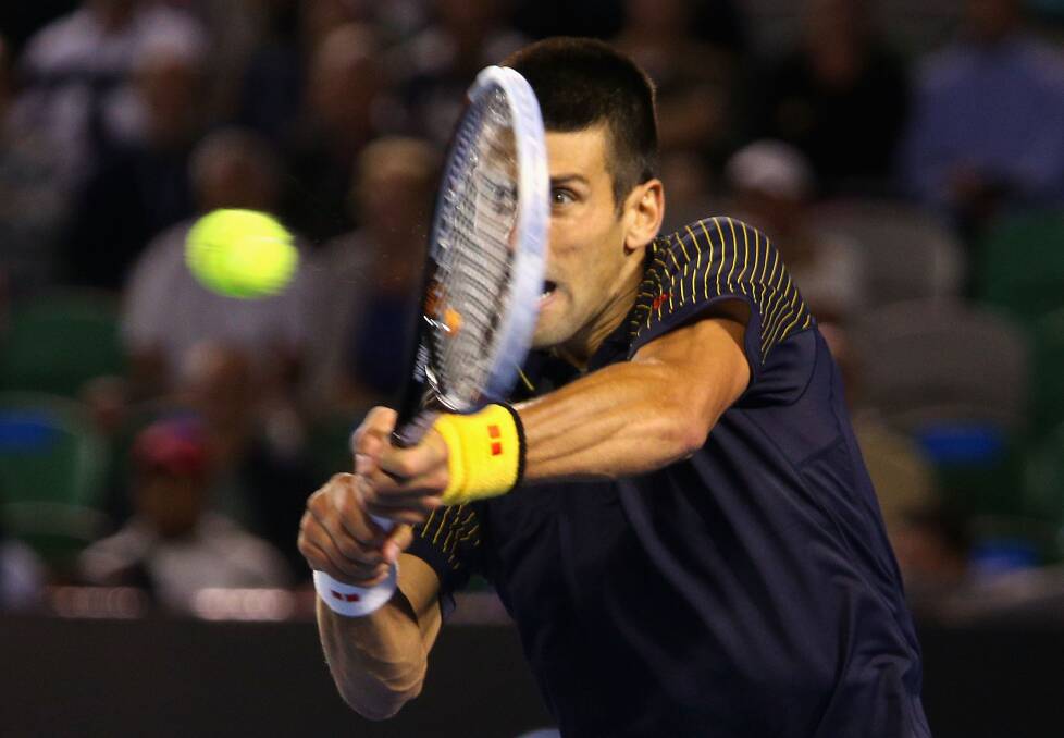 Novak Djokovic plays a backhand in his fourth round match. Photo: Robert Prezioso/Getty Images