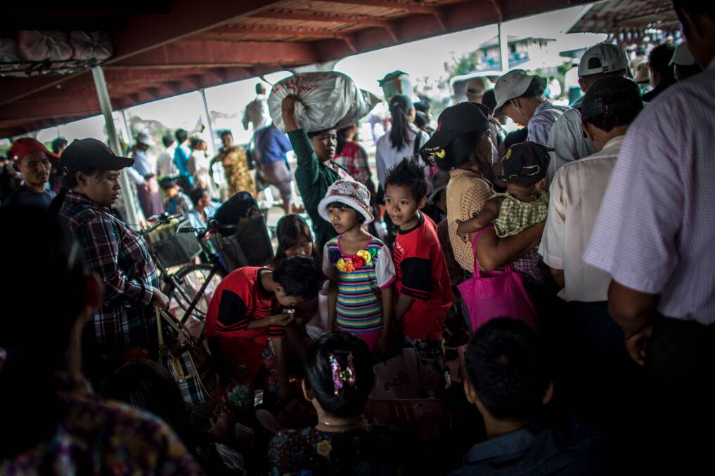 People wait to get off the ferry at Dala jetty on February 11, 2013 in Yangon, Burma. Photo by Chris McGrath/Getty Images
