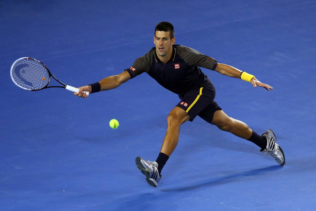 Novak Djokovic plays a forehand in his fourth round match against Stanislas Wawrinka during day seven of the Australian Open. Photo by Julian Finney/Getty Images