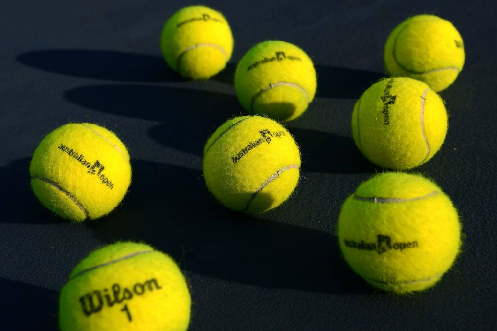 Detail of official tennis balls during day seven of the 2013 Australian Open. Photo by Vince Caligiuri/Getty Images