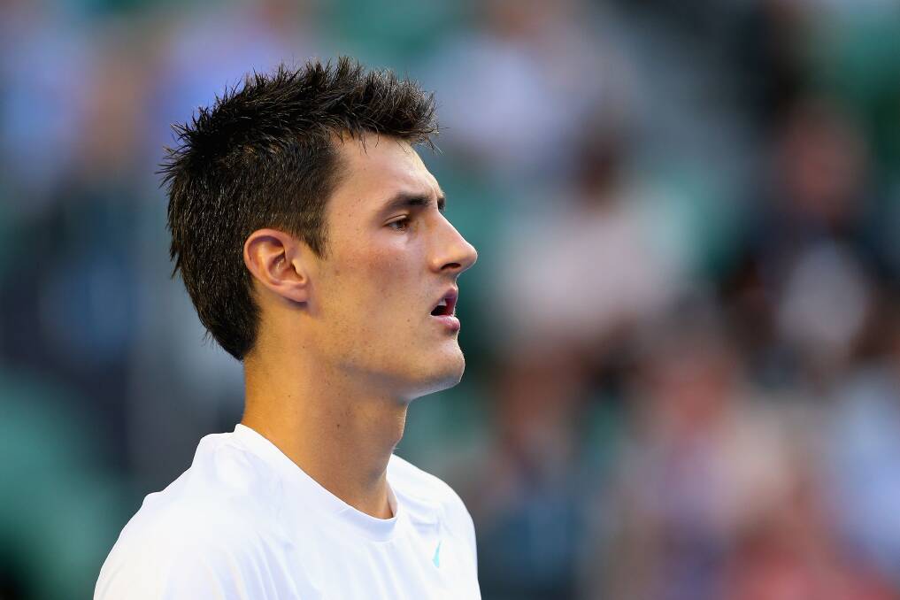 Bernard Tomic of Australia looks on in his first round match against Leonardo Mayer of Argentina during day two of the 2013 Australian Open. Photo by Cameron Spencer/Getty Images