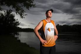Googong's Chad Fraser, 41, started running after struggling with his parents' deaths. Picture by Sitthixay Ditthavong