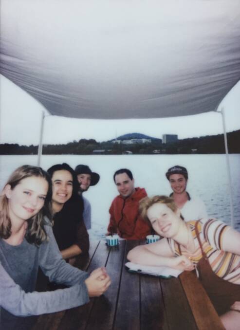 Photo of the team: Hannah Pengilly ('Aurora'), Shannon Parnell ('Death'), Chris Chacos (cinematographer), Scott Wray ('Businessman'), Will Scott (director), Kit Berry (art designer) on a boat on Lake Burley Griffin. Photo: Supplied.