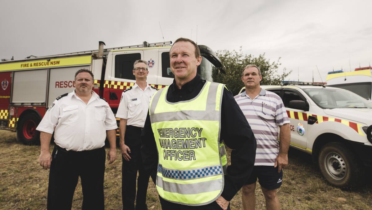 NSW RFS Lake George Zone superintendent Tim Carrolland membership services officer Darren Marks, NSW Police south eastern Regional Emergency Management Officer Paul Lloyd and duty officer and emergency services operations controller for the Carwoola fires, Michael Handley.