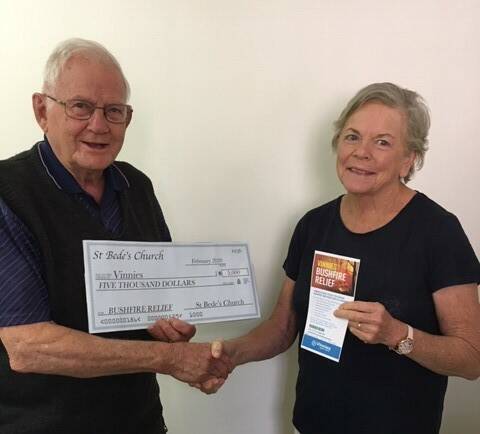 CHEQUE: Brother Brian Berg with Cathy Ffrench. Photo: Supplied.
