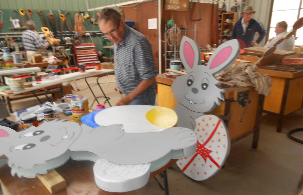 BUNNIES: Treasurer, John Bunn, working on Easter decorations in 2018. Photo: supplied. 