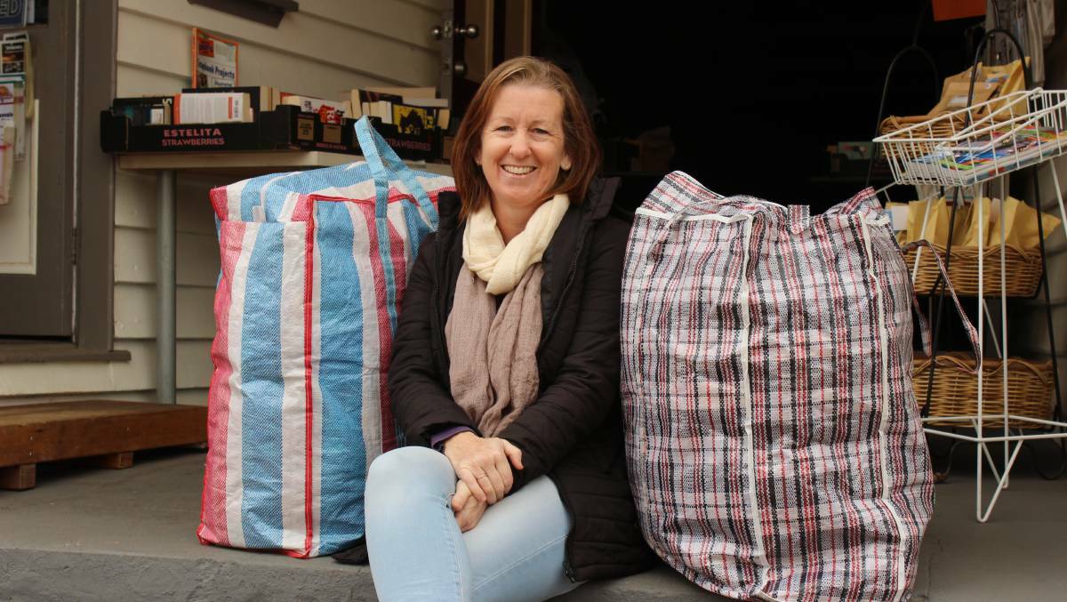 Compassion in bags: Tracey Davis in March with some of the supplies she delivered to Tathra. Photo: file