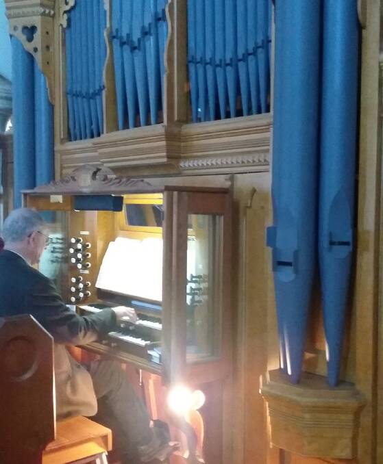 Dr James Forsyth playing St Andrew’s historic organ, 2018. (Photo: Mervyn Olds)