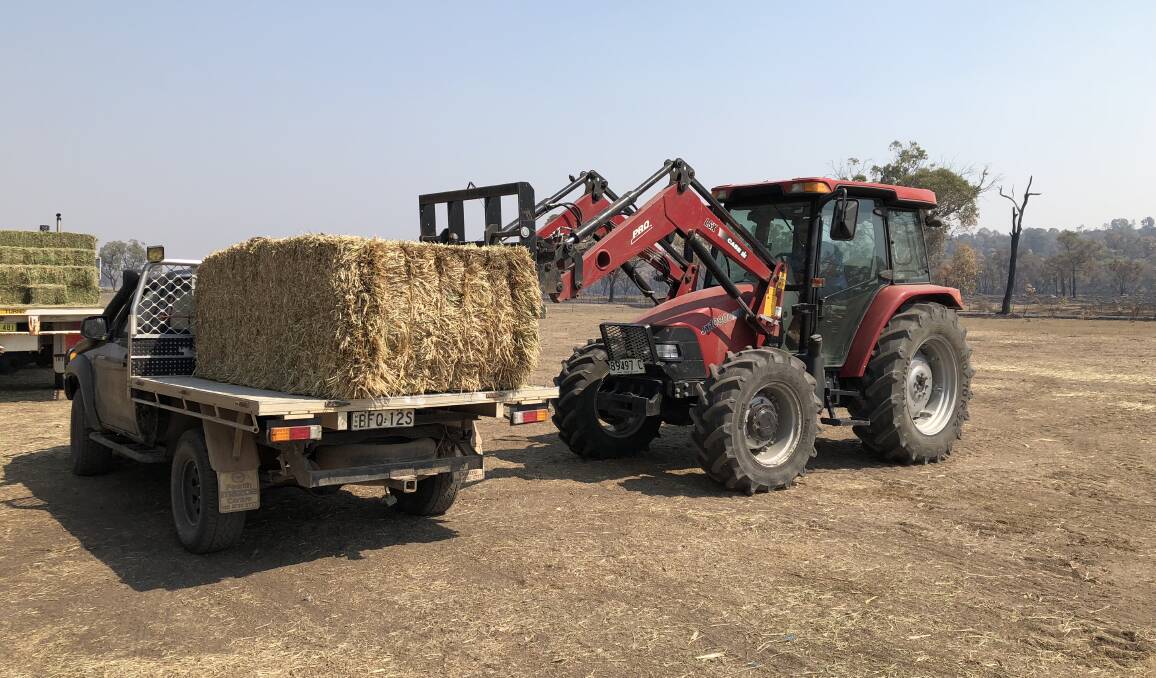 Local Land Services loading fodder relief bound for the North Black Range fireground. Photo supplied.