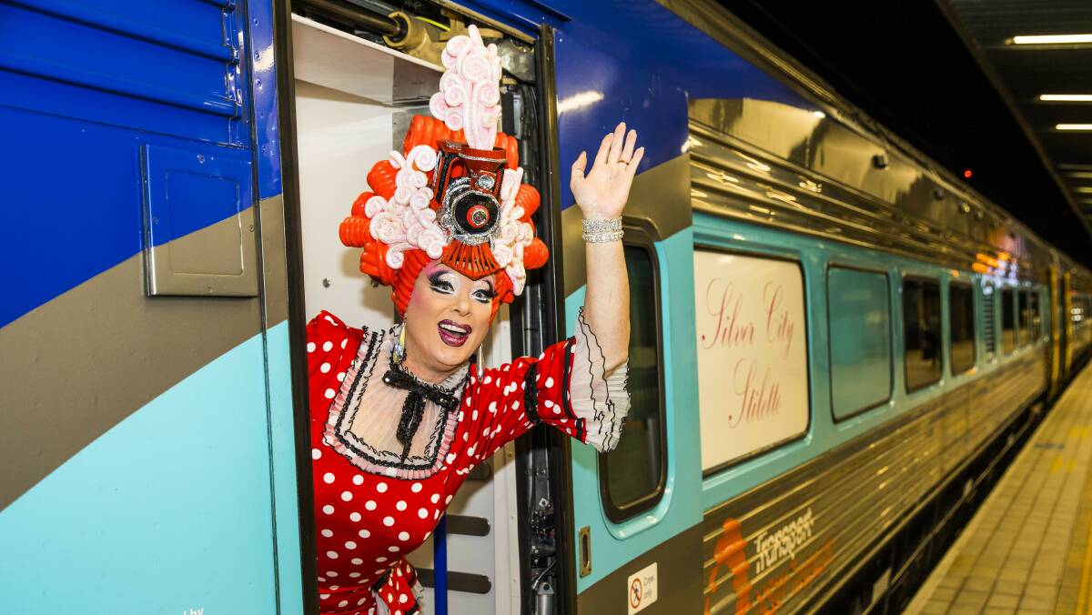 Host Maude Boate waves to locals as the Silver City Stiletto train bound for the Broken Heel Festival gets ready to depart from Central Station. Picture: Destination NSW