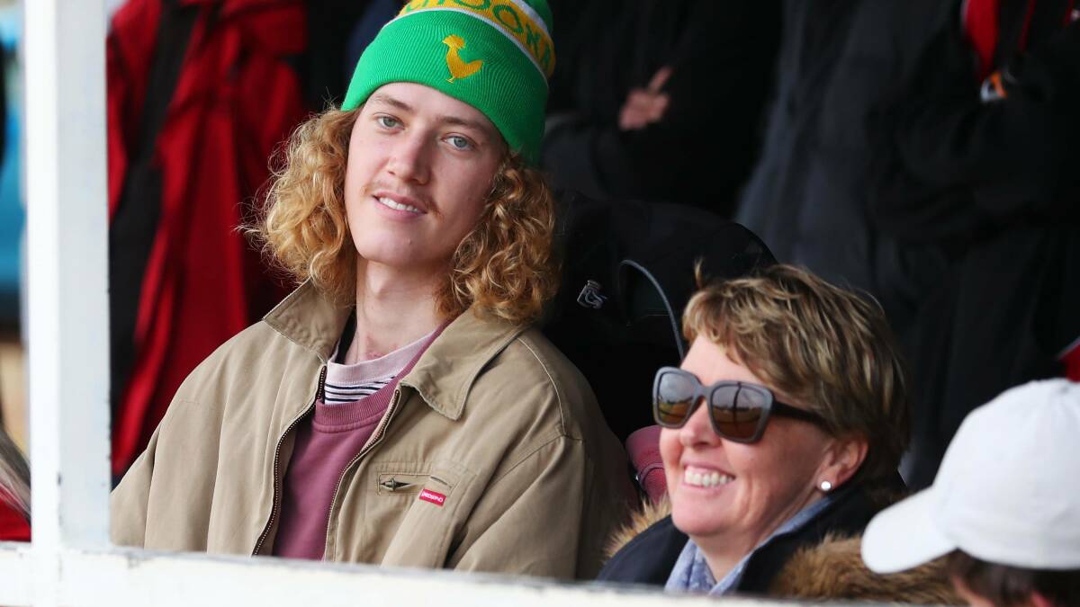 DAY OUT: Josh and his mum Leanne at the second semi-final last September. It was his first trip out of hospital, three months after going in. 