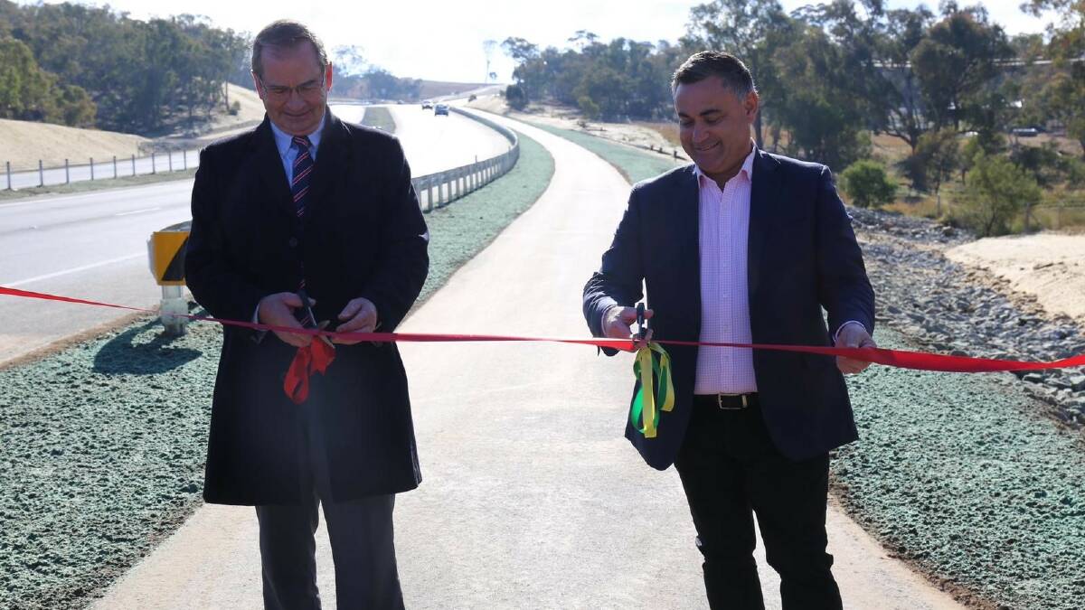 Member for Monaro John Barilaro and Queanbeyan Palerang Regional Council mayor Tim Overall officially open the Old Cooma Road duplication on Friday.