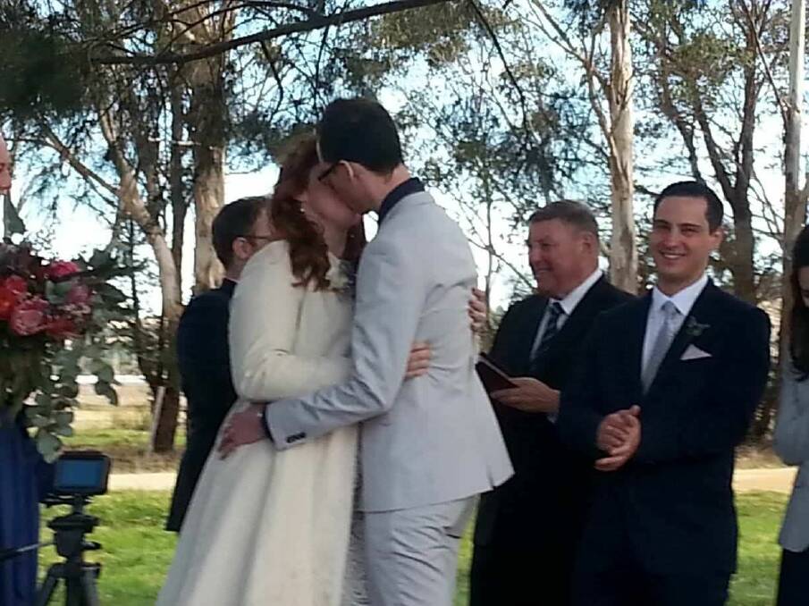 The vows are sealed with a kiss.