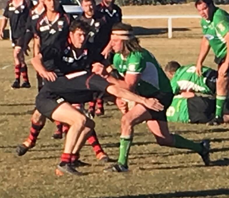 Tackle: Ben Howard and Dan Hart combine to prevent Jindabyne from running roughshod during the game, which was played on Saturday afternoon in Jindabyne. Photo: Supplied.