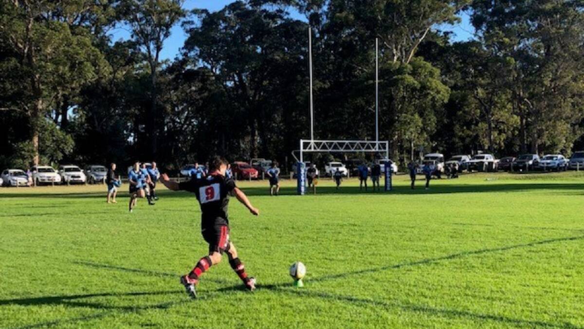 Slot it: Kiwi Hopkins kicks a difficult conversion for the Redbacks in the course of their 53-0 thumping of Broulee on Saturday, which sets Braidwood up for an important clash against Yass. Photo: Supplied.