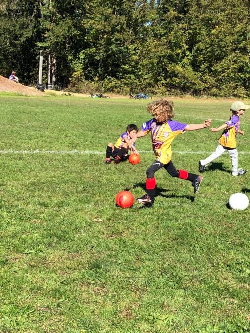 Big kick: River Parsons striking for the Under 7’s on Saturday morning. The youngster was one of over a hundred kids to take part. Photo: Ella Parsons. 
