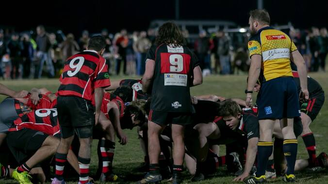 Wait for it: Bill Hatzis feeds the scrum in front of the big crowd at the Redback’s inaugural game under lights at the Rec Ground last season. Photo: Kathy Toirkens.