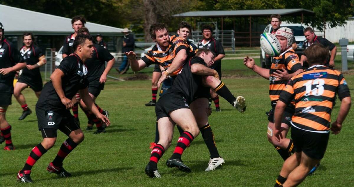 Impact: Will Shoemark tackles in defence and is supported by Simon Hopkins during the Redbacks' defeat against Taralga on Saturday. Photo: Gordon Waters. 