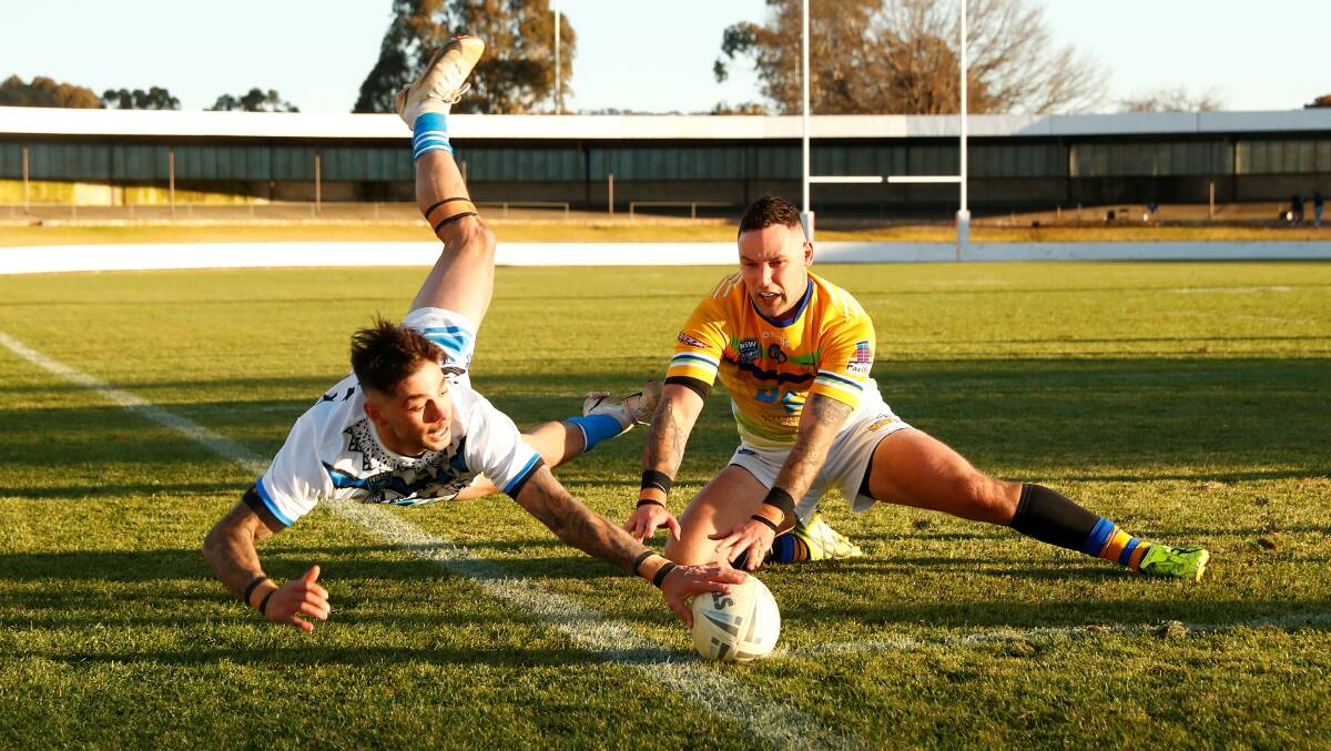 Queanbeyan Blues' Adam Misios dives in the corner to score. Picture: Keegan Carroll
