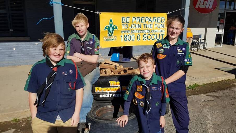 1st Braidwood Scouts Hamish, Charlie, Jacob and Hannah selling raffle tickets for a trailer load of wood, out the front of the Braidwood IGA this month.