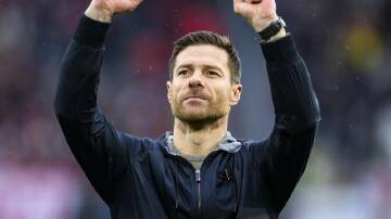 Coach Xabi Alonso celebrates another triumph for his unstoppable Bayer Leverkusen side. (AP PHOTO)