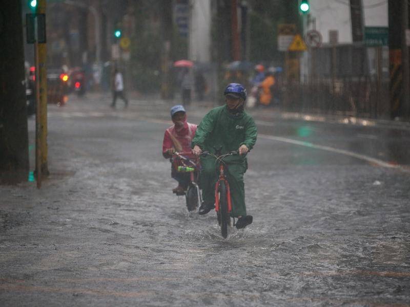 Monsoons have flooded Manila as the Philippines grapples with one of Asia's worst COVID outbreaks.