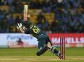 Australia's World Cup hero Travis Head losing his balance in Bengaluru in their six-run T20 defeat. (AP PHOTO)