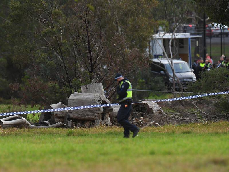 Police have identified a woman whose body was found in a north Melbourne park.