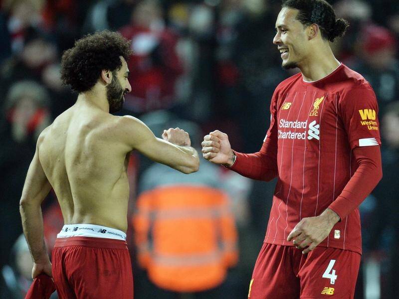 Mohamed Salah (L) ripped off his shirt after scoring in Liverpool's 2-0 win over Manchester United.