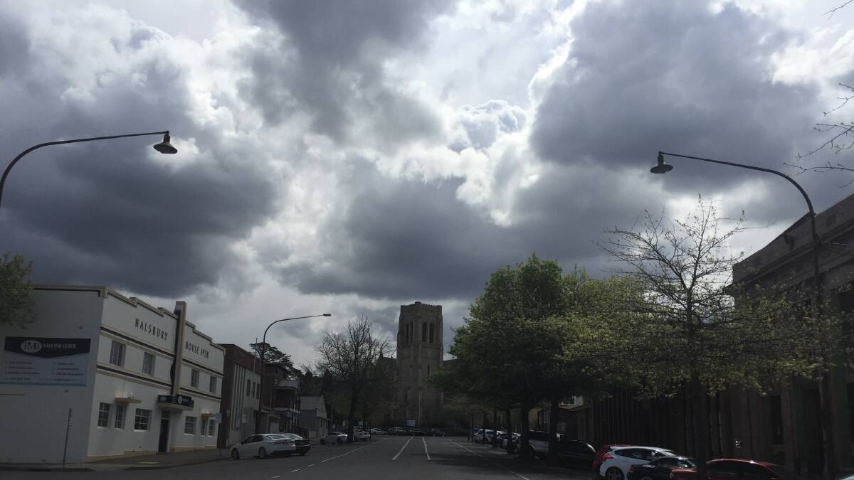 Dark clouds give hope of rain on Montague St, Goulburn, looking up to St Saviour's. Photo: Louise Thrower