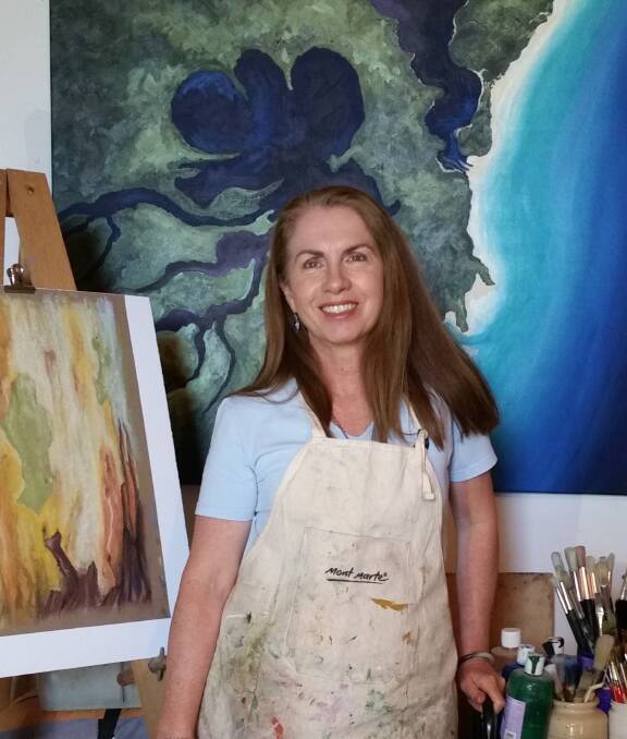 Janita Byrne with artwork. Photo: supplied.