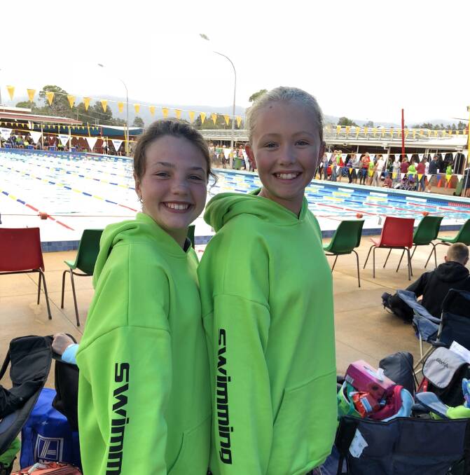 STRONG SWIMMERS: Tanya Percy and Laynee Saunders are all smiles at the Dapto Regional Swimming Carnival. Photo: Supplied.