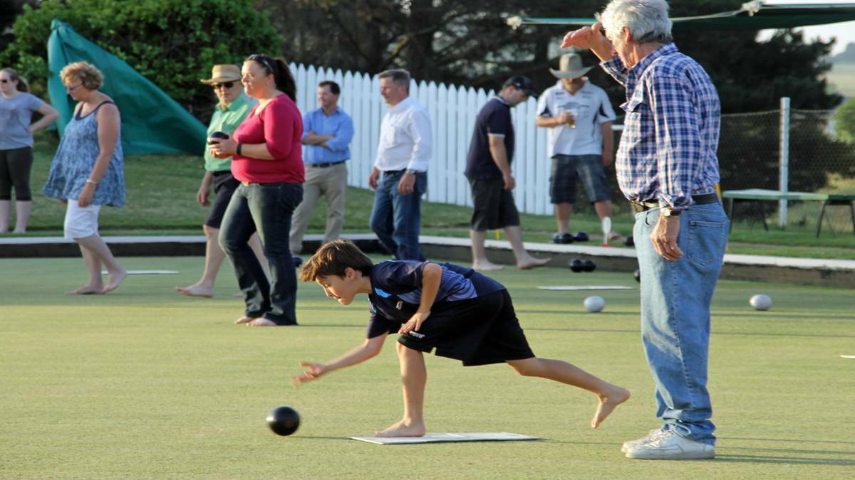 Not so green: A young bowler places a shot at Barefoot Bowls in 2015. Photo: file.