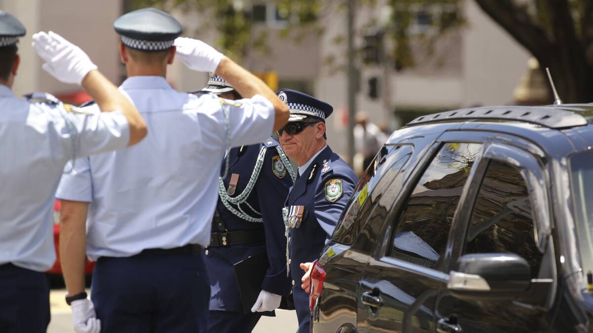 Police Commissioner Andrew Scipione arrives at the funeral of Detective Inspector Bryson Anderson. Photo: KATE GERAGHTY