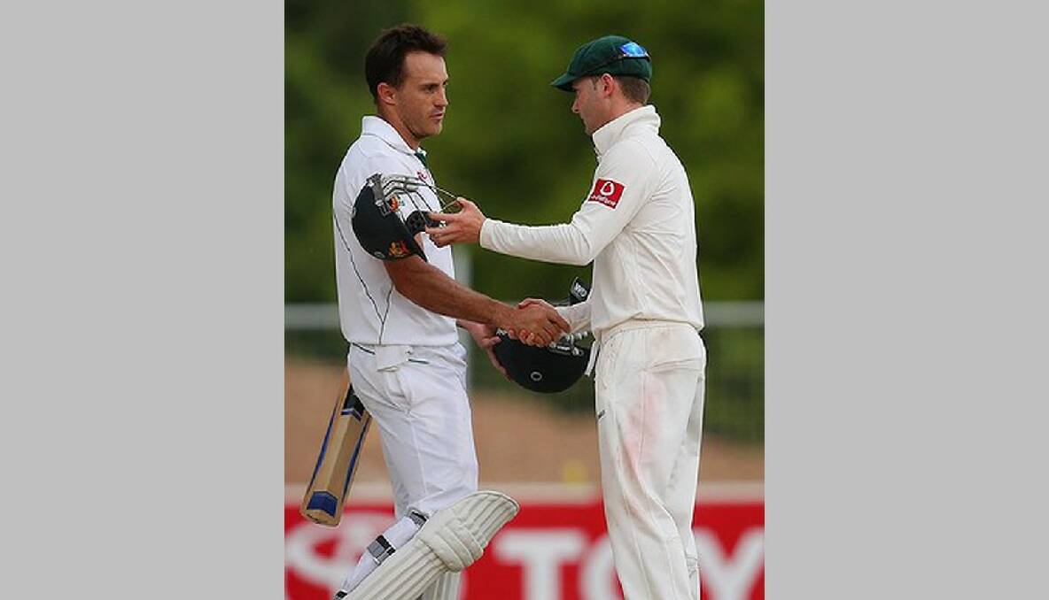 Match-saver Faf du Plessis (78 and 110 not out) shakes hands with Australian captain Michael Clarke (230). Photo: Getty images