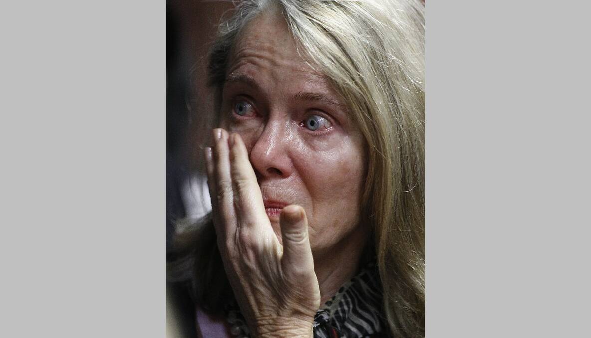 A relative of Oscar Pistorius reacts at the end of his court appearance in the Pretoria Magistrates court, February 19, 2013. Photo: REUTERS/Siphiwe Sibeko