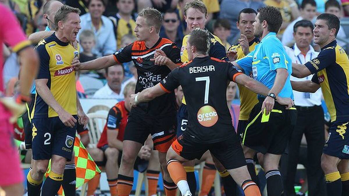 Besart Berisha in a heated exchange after a tackle on Pedj Bojic. Photo: Brendan Esposito