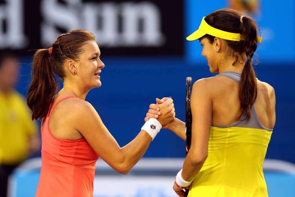 Agnieszka Radwanska shakes hands with Ana Ivanovic after their fourth round match. Photo by Julian Finney/Getty Images