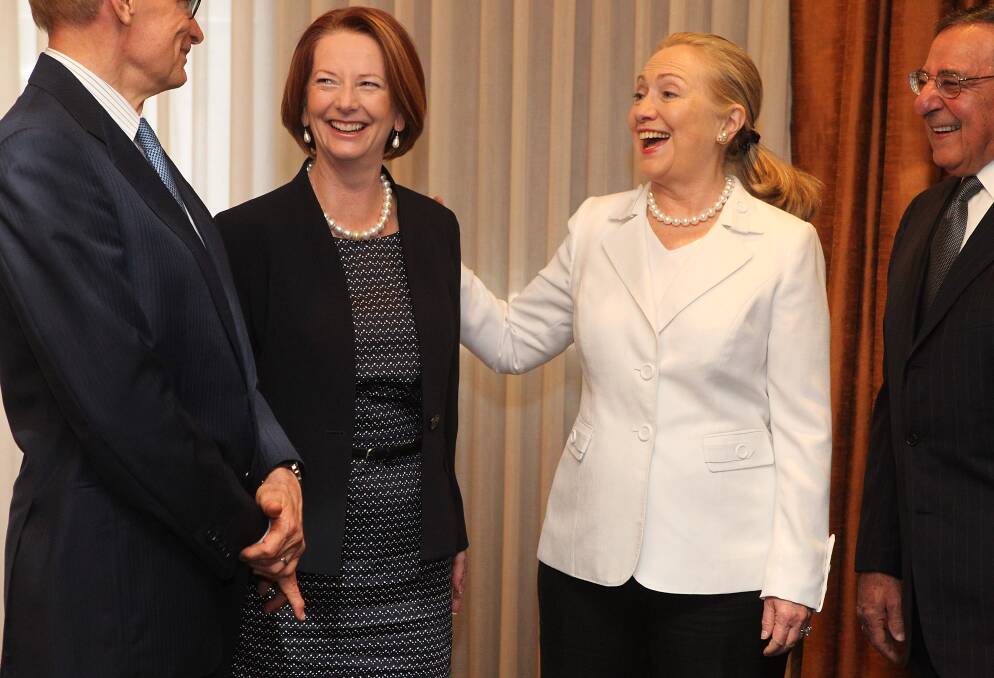 Australian Minister for Foreign Affairs Bob Carr, Australian Prime Minister Julia Gillard, US Secretary of State Hillary Clinton and US Secretary of Defense Leon Panetta share a joke during the annual Australia-United States Ministerial Consultations at the Hyatt Hotel in Perth, Australia. Photo by Colin Murty - Pool Getty Images