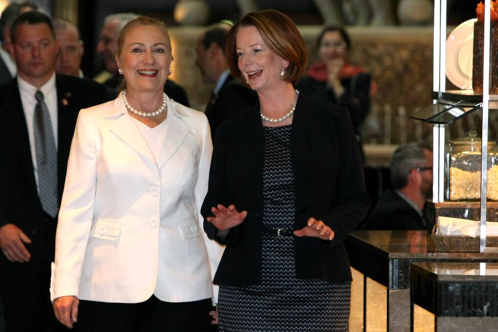 The Prime Minister of Australia Julia Gillard walks with the US Secretary of State Hillary Clinton upon arrival for afternoon tea during the annual Australia-United States Ministerial Consultations at the Hyatt Hotel in Perth, Australia. Photo by Colin Murty-Pool/Getty Images