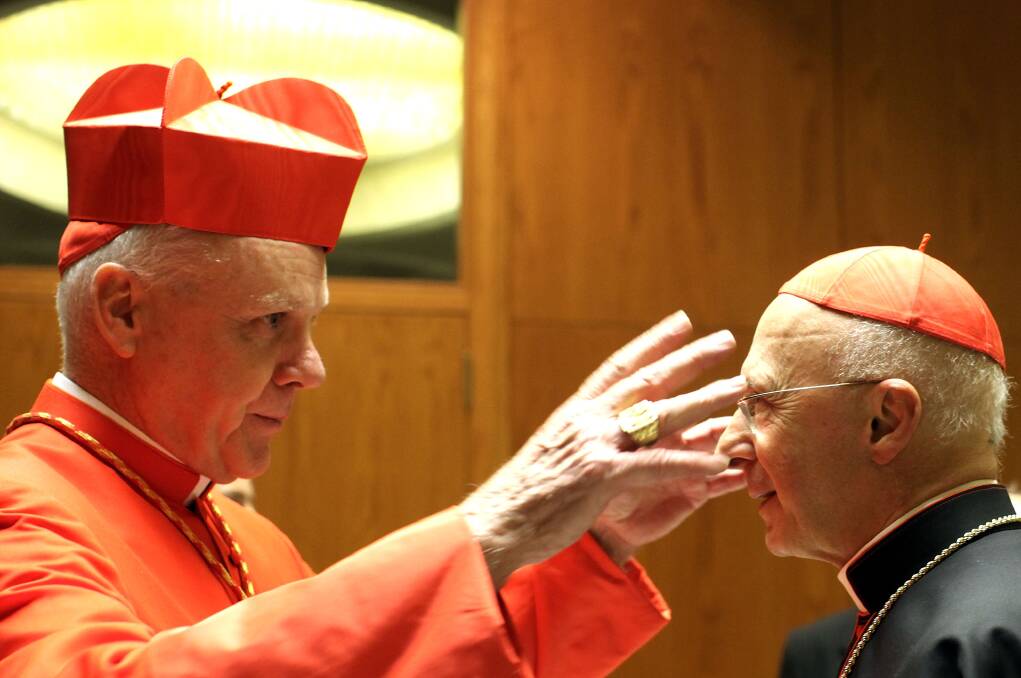 8. Cardinal Angelo Bagnasco of Italy (left).
