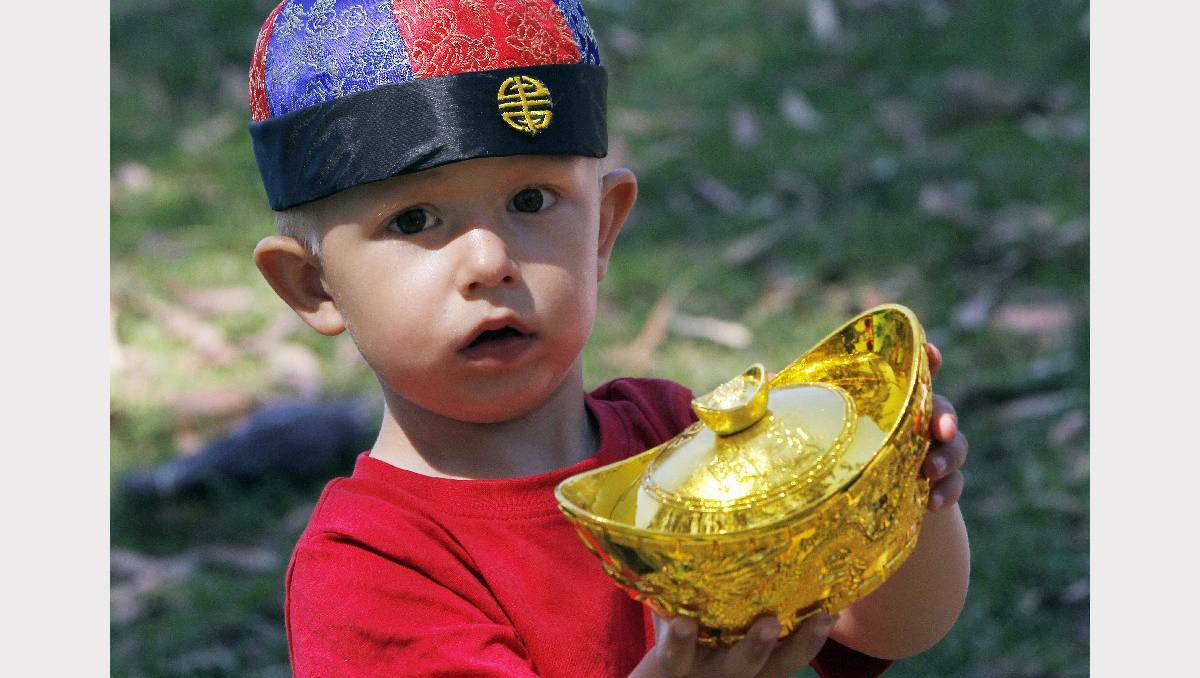 Two-year-old Bailee Lamount explores Chinese artifacts. Photos: ANDY ZAKELI
