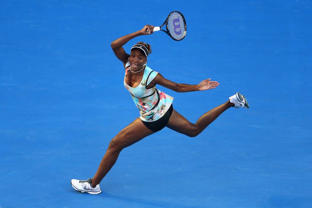 Venus Williams of the United States plays a forehand in her second round match against Alize Cornet of France. Photo by Julian Finney/Getty Images