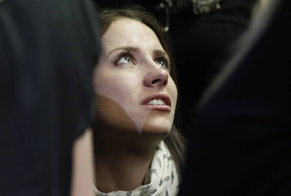 Oscar Pistorius's sister Aimee reacts at the end of his court appearance in the Pretoria Magistrates court February 19, 2013. Photo: REUTERS/Siphiwe Sibeko