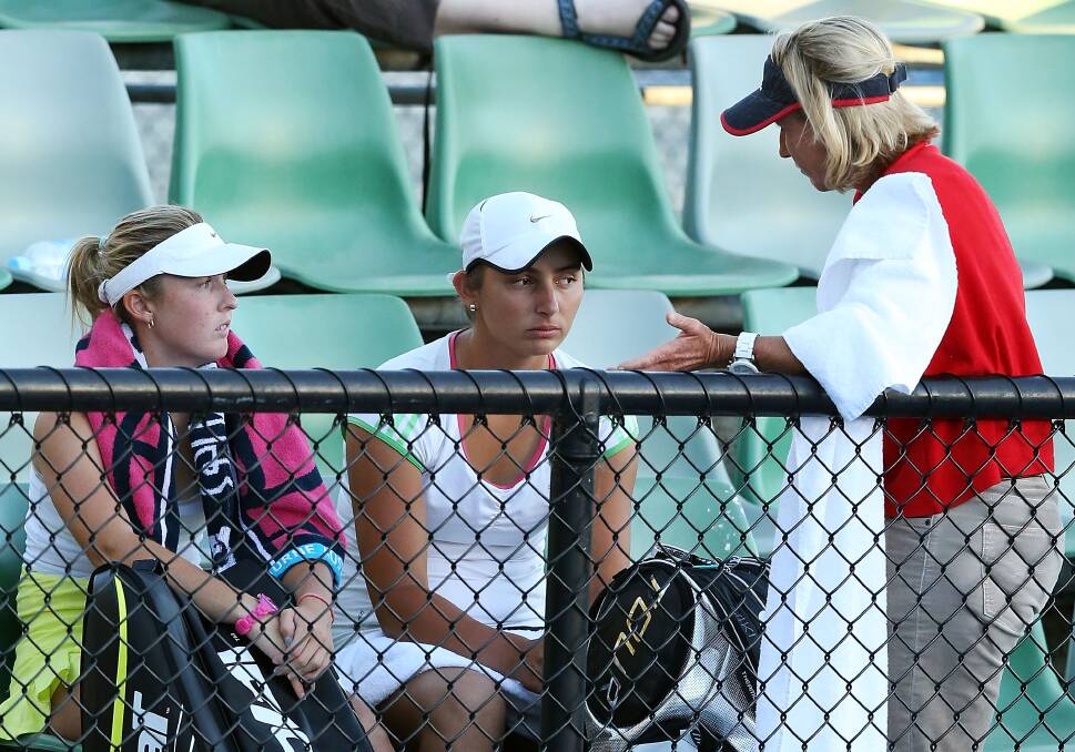Storm Sanders and Viktorija Rajicic of Australia are spoken to by Nicole Pratt after their loss in their first round doubles match against Natalie Grandin of South Africa and Vladimira Uhlirova of The Czech Republic. Photo by Michael Dodge/Getty Images